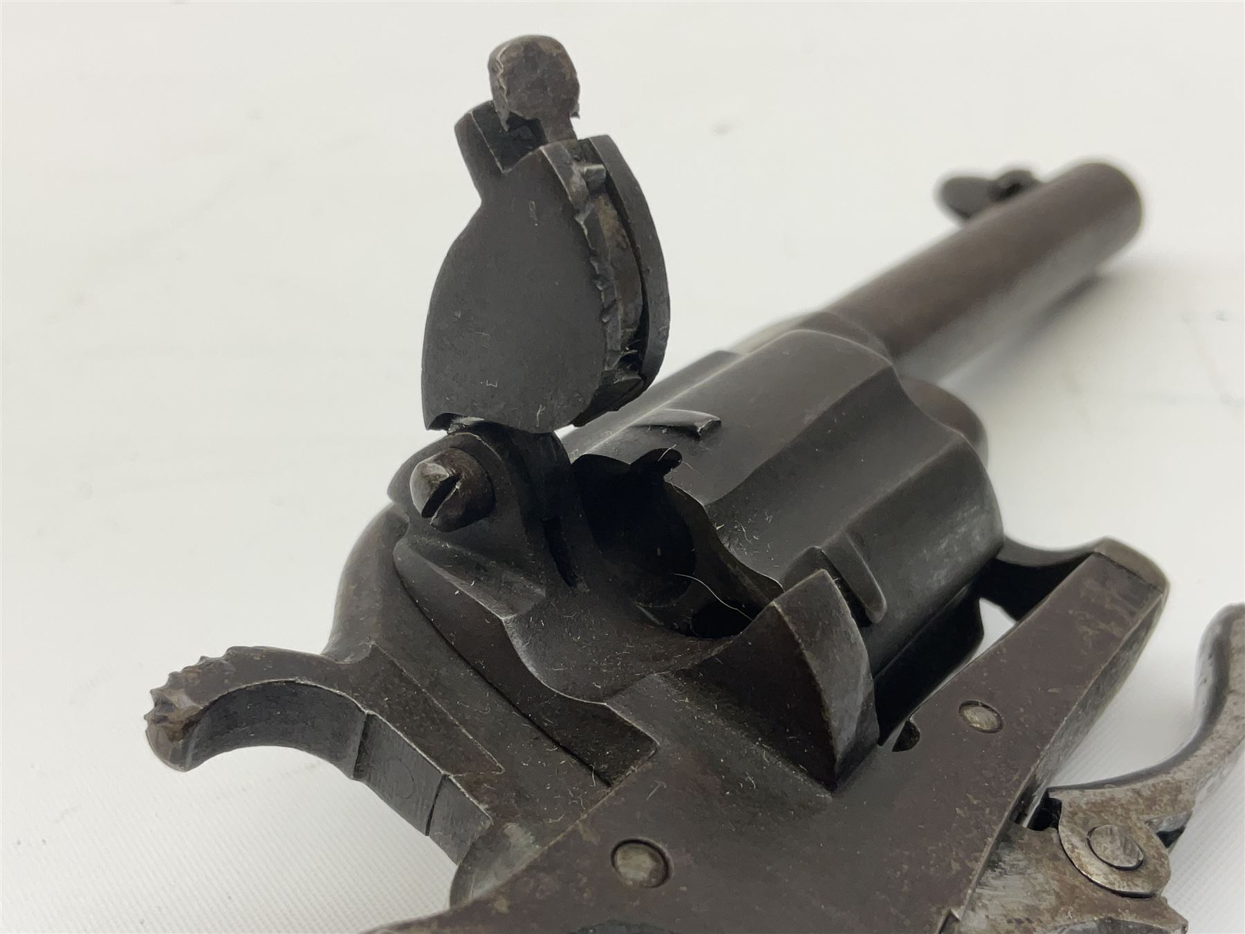 19th century Belgian Flobert 7mm pin-fire revolver with six-shot cylinder, 7cm octagonal to round barrel, folding trigger and walnut stock incorporating ejector rod in butt L18cm overall