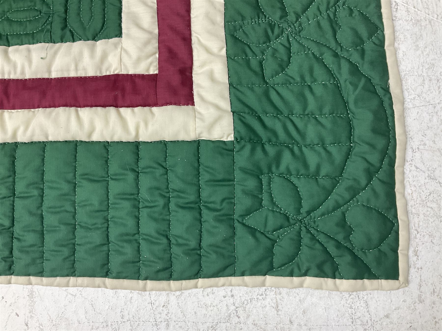 20th century quilt, with repetitive ship design to the centre within a cream red and green boarder, 227cm x 222cm