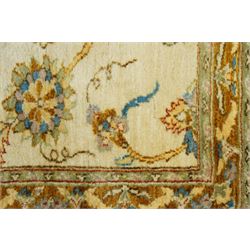 Modern Pakistani Oushak style hand-knotted runner,  ivory field with an all-over scrolling floral vine design incorporating stylized palmettes and rosettes in soft tones of pale blue, sage green and muted gold, enclosed by conforming border, cotton fringe ends 