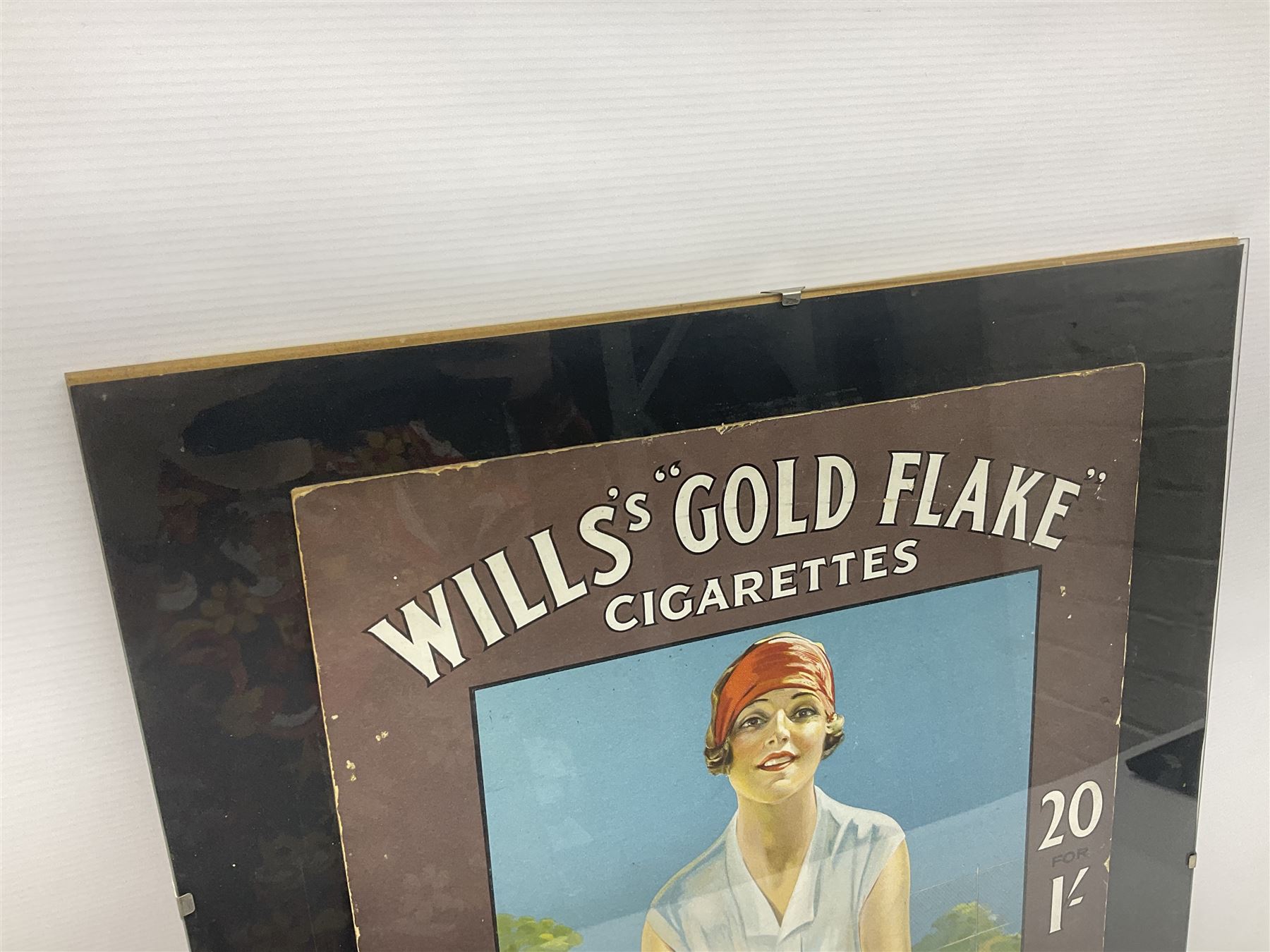 Wills Gold Flake Cigarettes advertising board, framed depicting a lady at the tennis, advert H51cm, L38cm