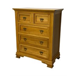 Frank Hudson - contemporary light oak chest, rectangular moulded top over two short and three long drawers, brass oval backplates with circular drop handles, on a moulded plinth base with bracket feet