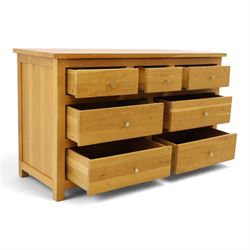 Contemporary light oak chest, rectangular top fitted with three short over four long drawers, on square feet