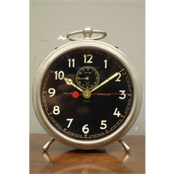  Early to mid 20th century 'Goliath Repeater' circular polished metal alarm clock, black dial with Arabic numerals, subsidiary alarm dial, twin coil H.A.C movement, D14cm (excluding handle)    