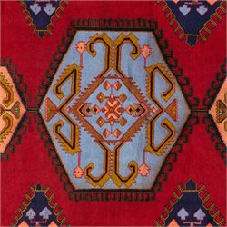 Turkish Anatolian hand-knotted carpet, red field centred by a large pale blue geometric medallion flanked by pink octagonal medallions, scattered stylised motifs, enclosed by multiple geometric borders