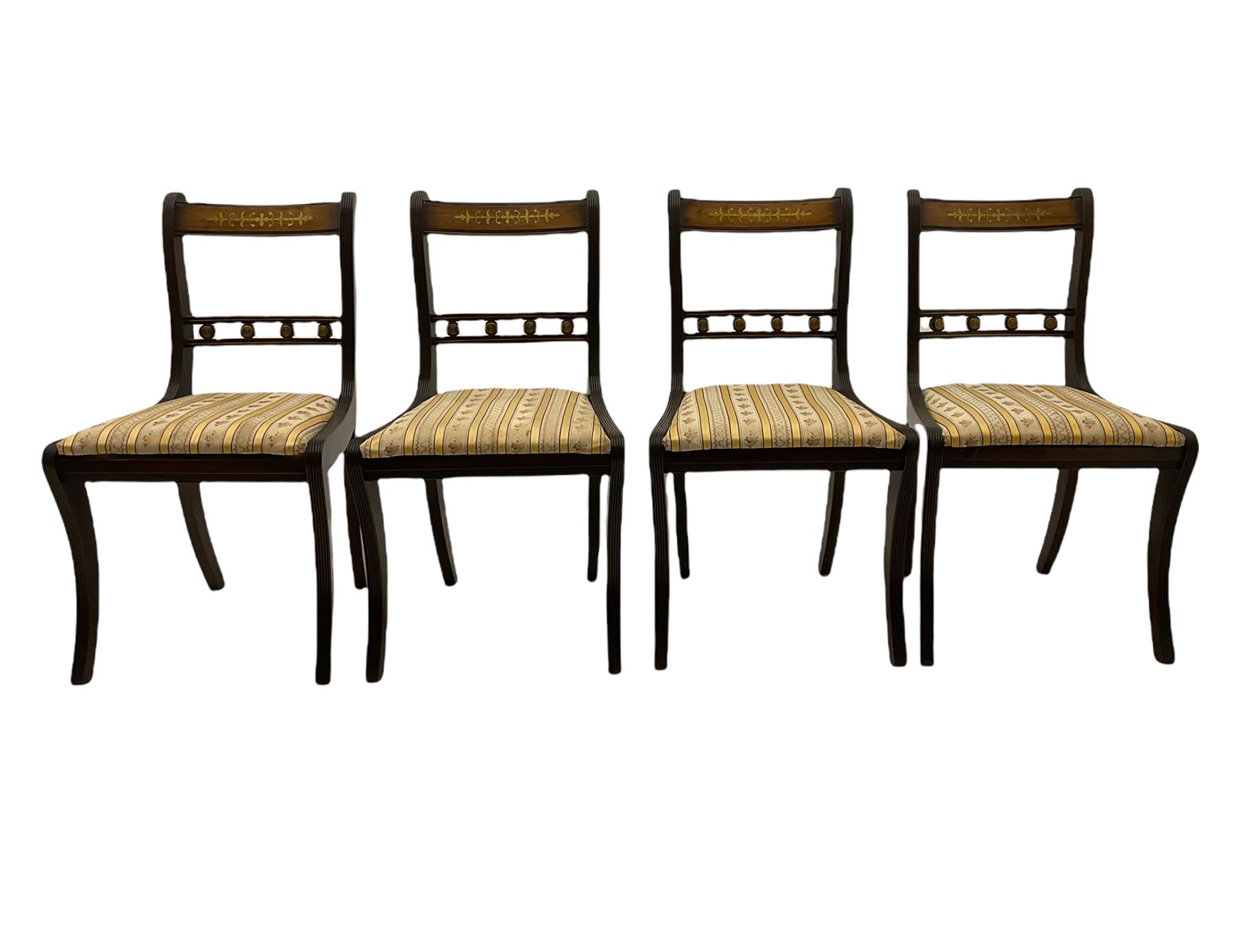 Set of eight Regency style mahogany dining chairs, brass inlay with gilded detail