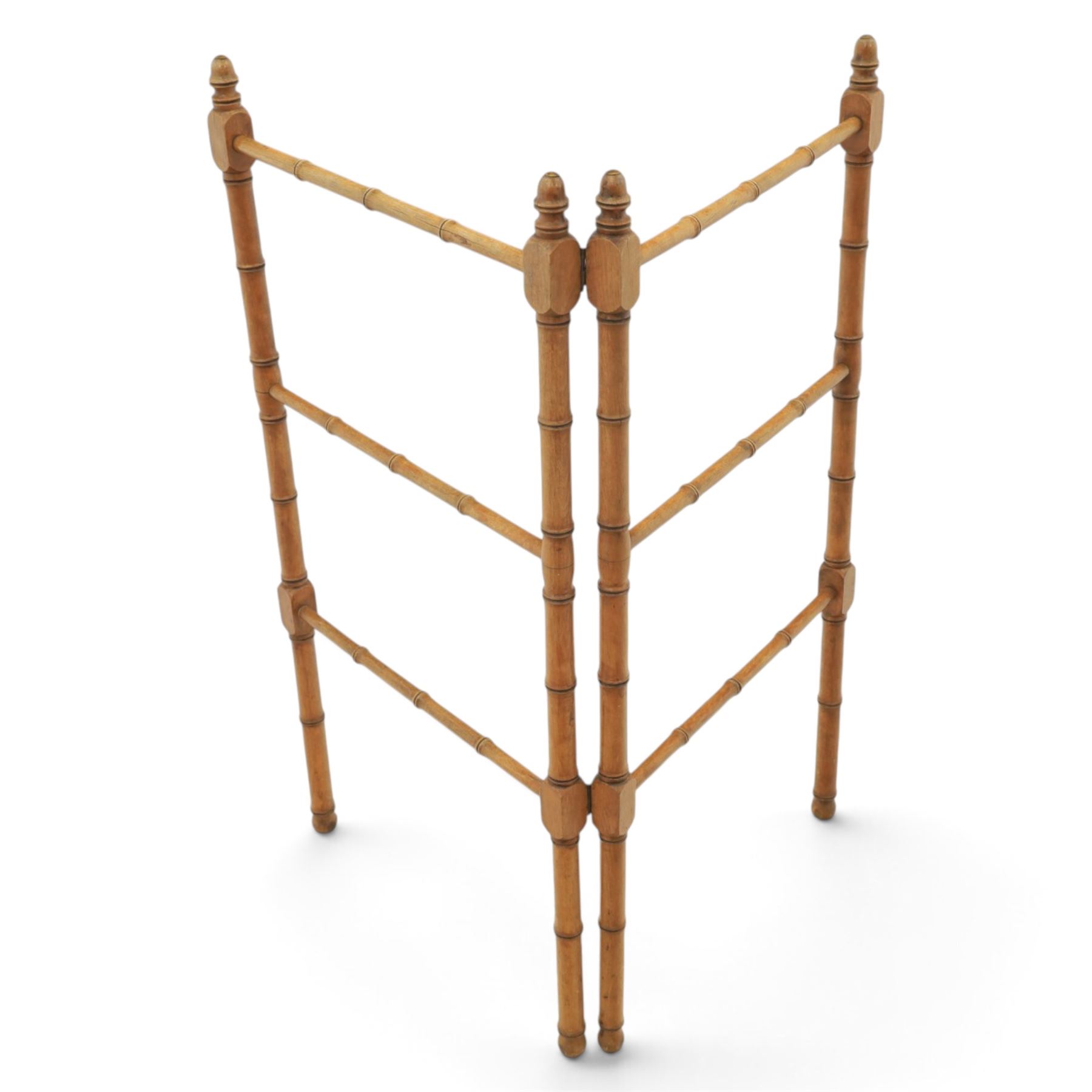 Victorian simulated bamboo two section towel rail, with turned brass capped finials, with three rails for hanging, hinged at one side