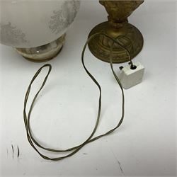 Gilt metal table lamp, heavily embossed with flowers and butterflies, with fluted frosted glass shade, H56cm