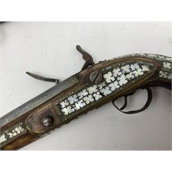 Modern non-firing reproduction Tower flintlock pistol marked with crowned GR and Tower to the lock, brass skull crusher butt and fittings L40cm overall; another Indian/Moorish reproduction flintlock pistol with mother-of-pearl inlay; and a modern die-cast replica Colt style revolver (3)