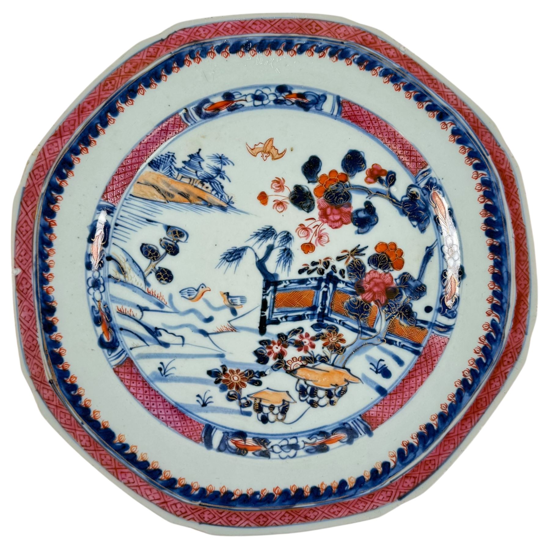 Chinese Qianlong plate of hexagonal form, decorated with riverside scene in a floral boarder D23cm