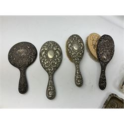 Glass dressing table tray, scent bottles and lidded bowl, metal mounted foliate design hair brushes and handheld mirrors etc