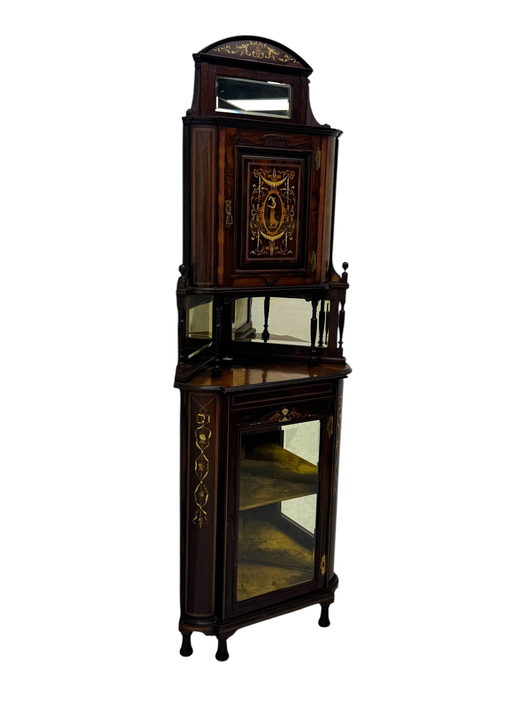 Late 19th century inlaid rosewood free standing corner display cabinet, the upper section featuring a mirrored panel above an inlaid cupboard with a felt-lined interior, complemented by a recessed open compartment with a mirrored back, the base with a glazed door enclosing two felt-lined shelves, on turned supports