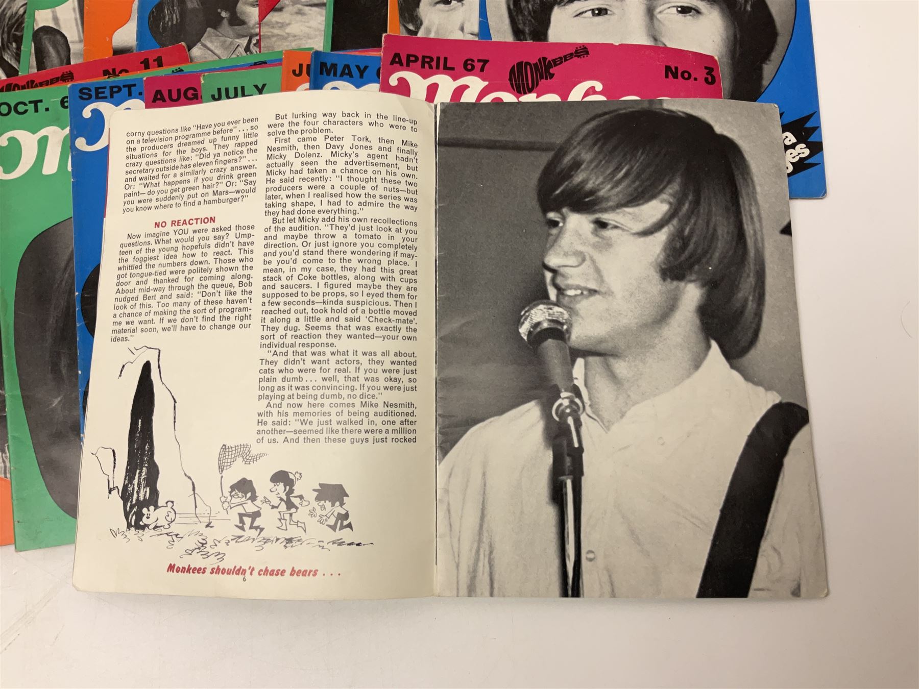 Monkees memorabilia - 'Monkees Monthly' magazine almost complete run from No.1 Feb 67 to No.31 Aug 69 (lacking nos.29 and 32); the cover of No.1 signed by all four members of the group during their 1997 Reunion Tour; quantity of A&BC bubble gum cards; programme for their only UK live performance in 1967 at Empire Pool Wembley; and other related late 1960s music magazines/paperback book
