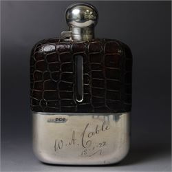 Early 20th century silver and leather mounted glass hip flask, with silver cover and remov...