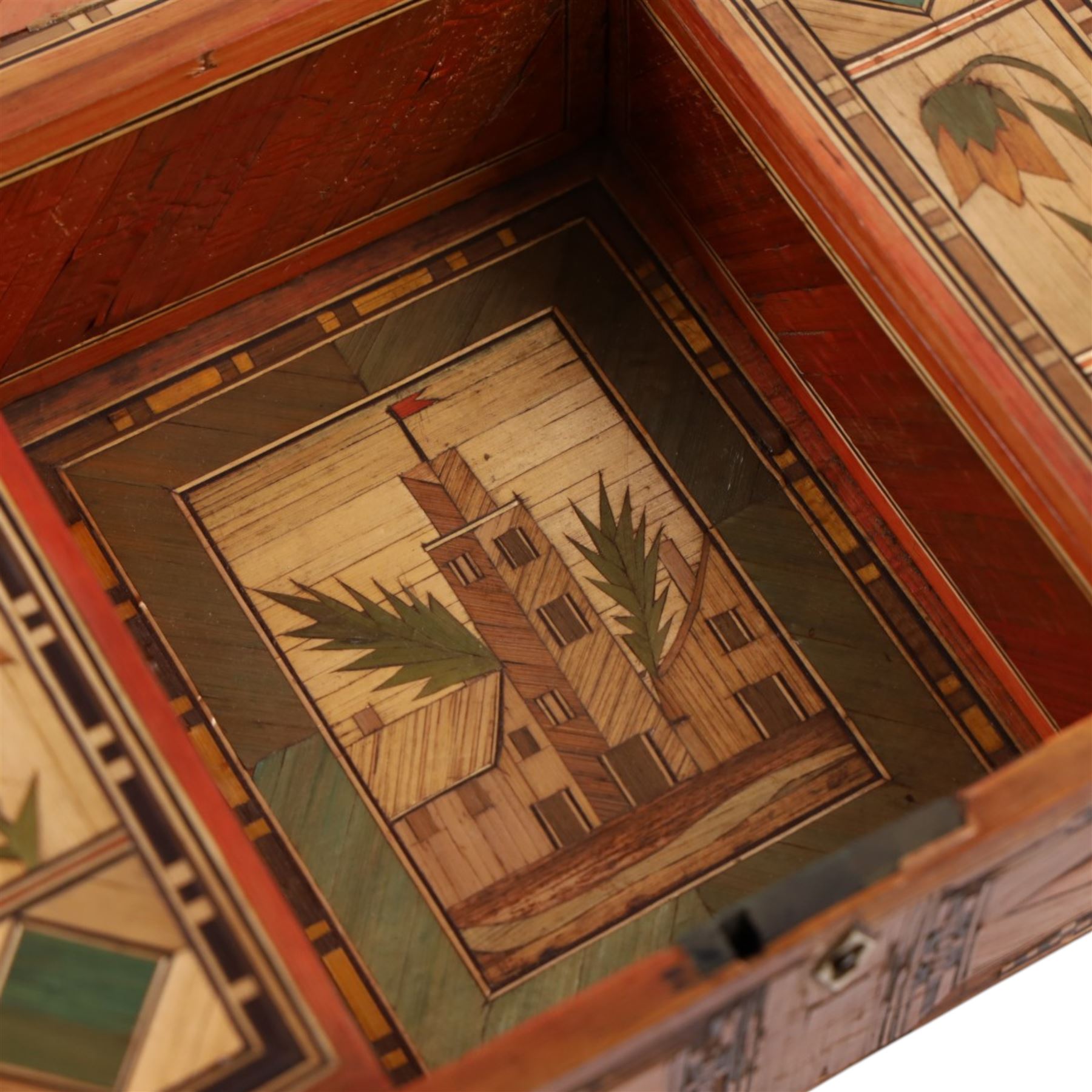 Napoleonic prisoner of war straw work box, the exterior with panels of buildings in geometric borders, the interior of the hinged lid opening to reveal two compartments with hinged covers decorated with flowers, H8cm, D16cm