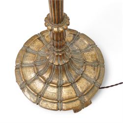 Late 20th century gilt wood standard lamp, turned and reeded column on lappet carved circular base 