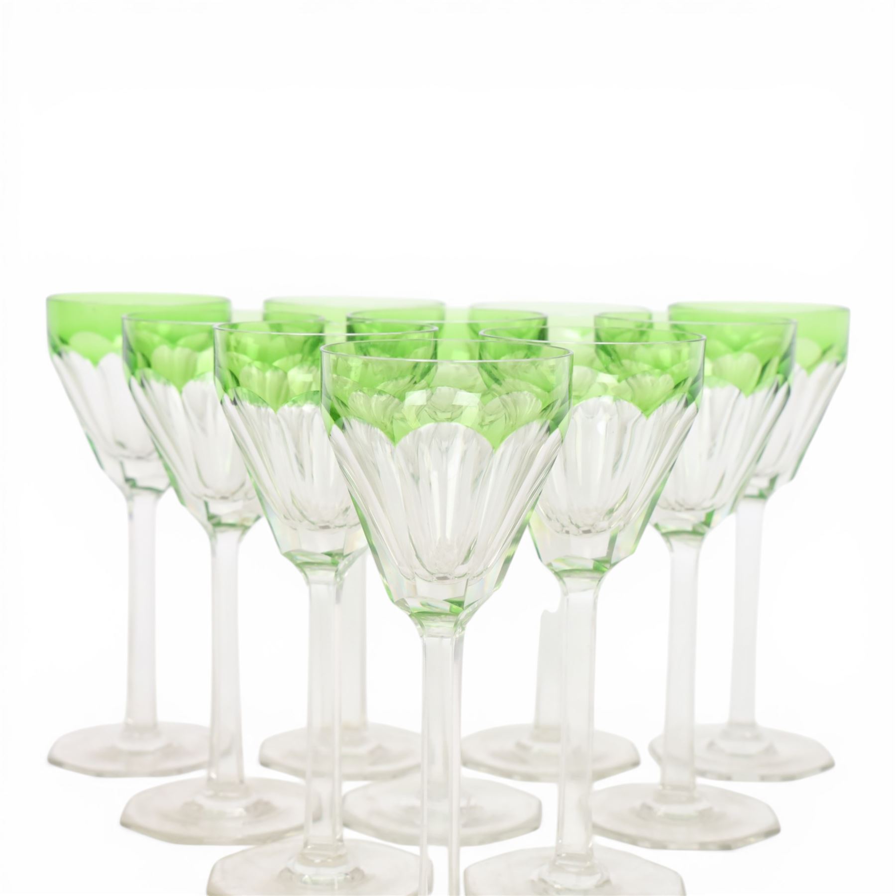 Set of ten wine glasses, of fluted form with chartreuse rim, upon a faceted stem, H20cm  
