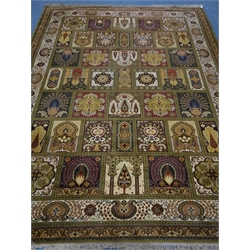  Keshan ochre ground rug, panelled pattern field with peacocks and stylised eastern motifs, repeating border, 365cm x 273cm  
