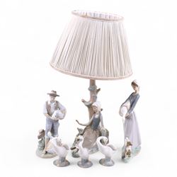 Lladro lamp, modelled as a girl beneath a tree together with four Lladro figures and one other 