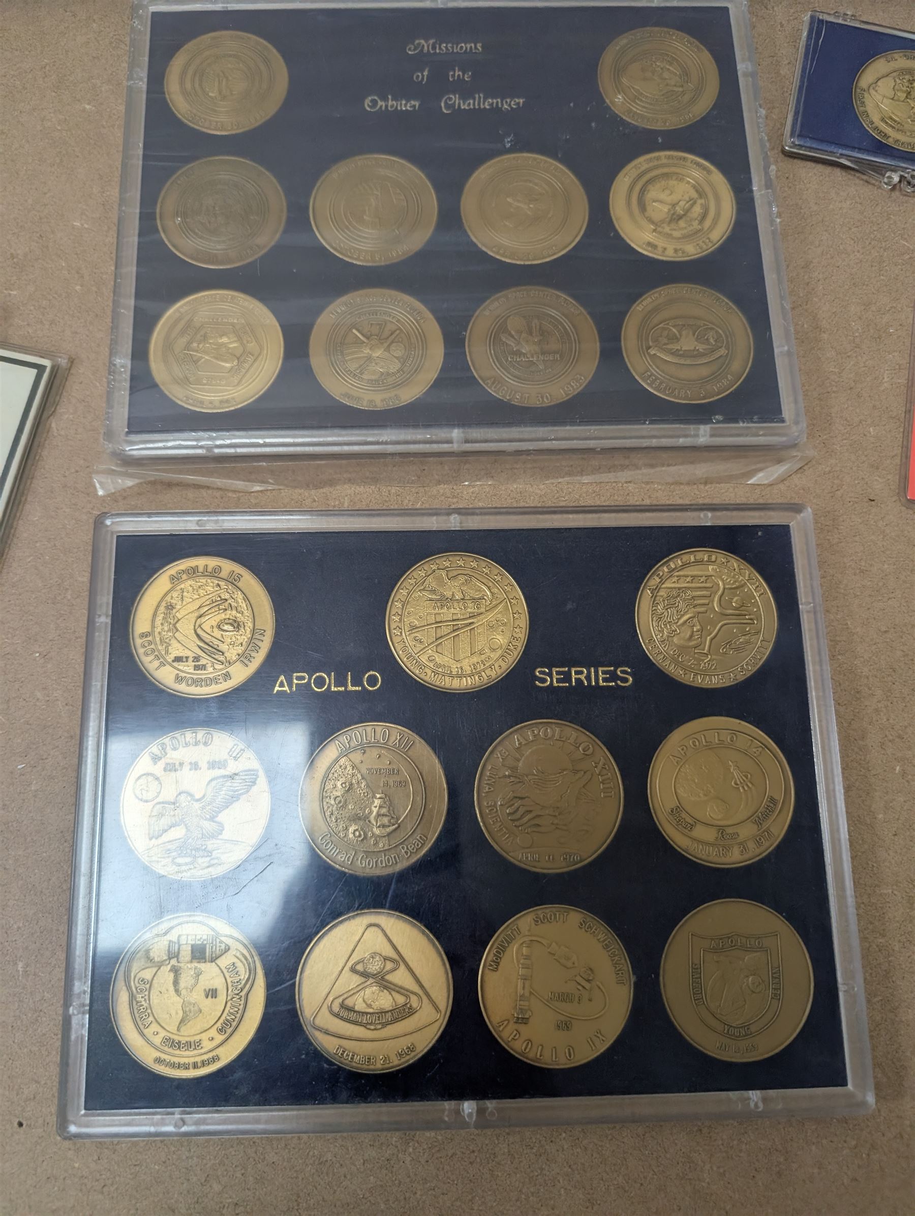Nasa Space Shuttle program commemorative items, including album of stamp covers, telephone cards, five Shuttle Crew Emblem Collector's Series medallions, Maiden Flights bronze medallions, Missions of the Orbiter Challenger set of medallions and Apollo series medallions