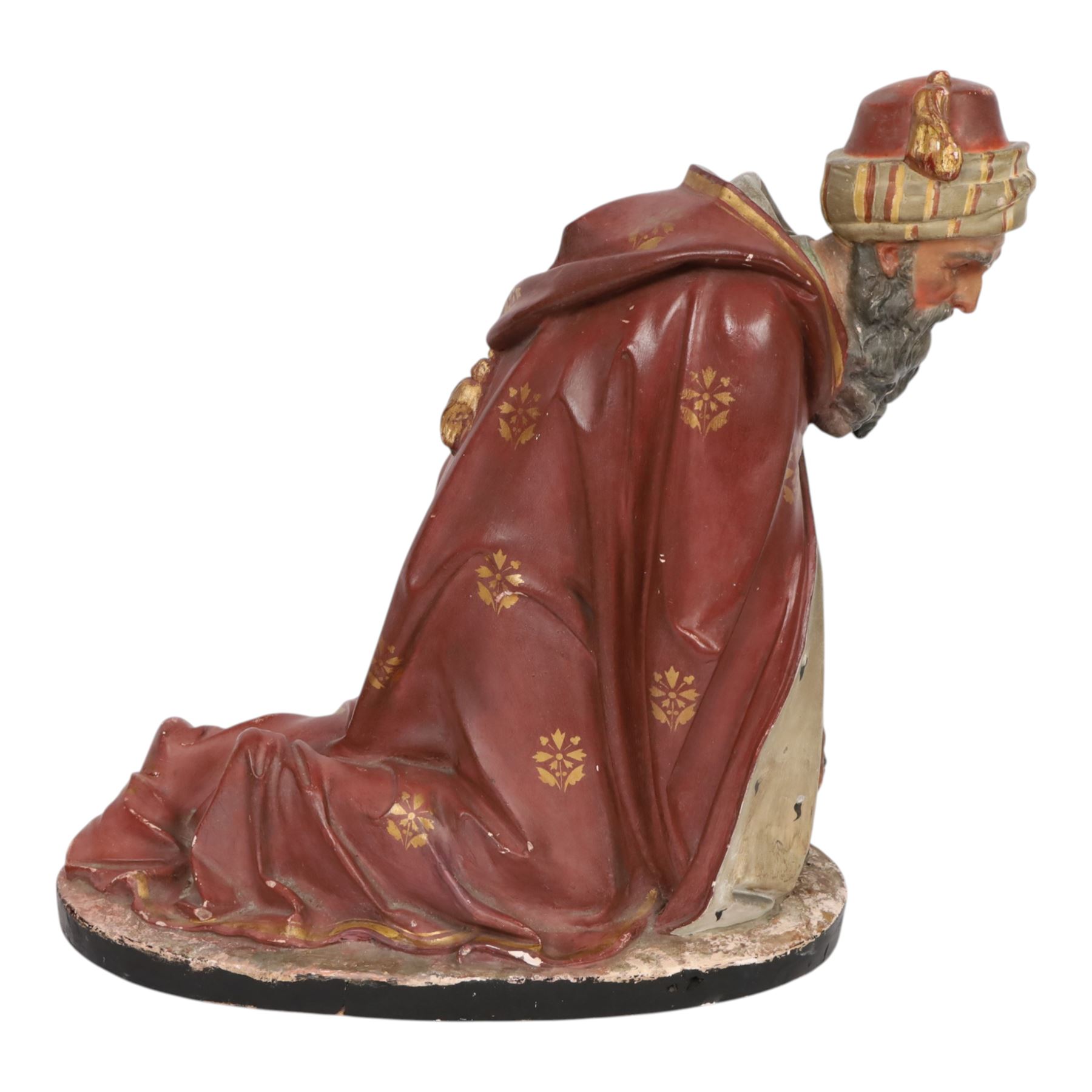 20th century painted plaster icon figure depicting one of the three wise men from a nativity sceen, kneeling and presenting his gift, H54cm 