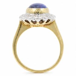 18ct gold black opal diamond cluster ring, single oval cabochon cut opal of 2.76 carat, surrounded by fourteen round brilliant cut diamonds, London 1998, total diamond weight 0.60 carat