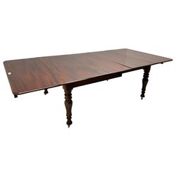 19th century mahogany extending dining table with three additional leaves, rectangular top with rounded corners, pull-out action, on turned and faceted supports with brass castors