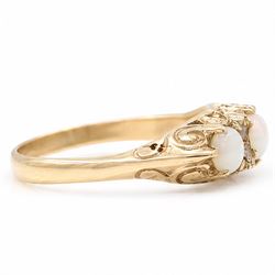 9ct gold three stone opal ring, with four diamond accents set between, Birmingham, 1971