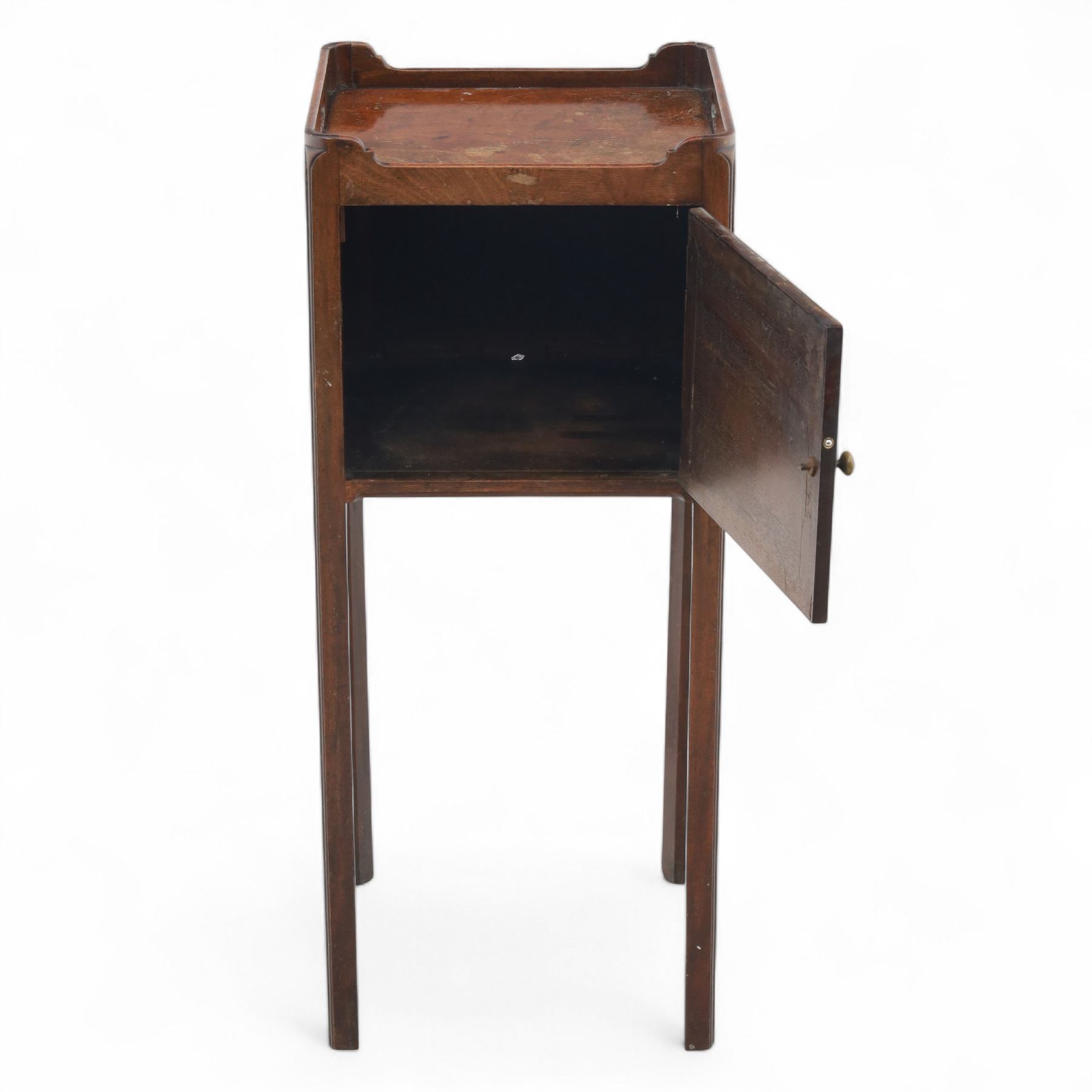 Georgian mahogany bedside cabinet of slender proportions, rectangular galleried top above a panelled cupboard door on square tapered legs 