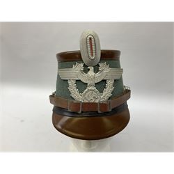 WW2 German rural police shako with helmet plate and liner; bears label 'Hans Romer Echt Fiber-Tschako Neu-Ulm (Donau)'