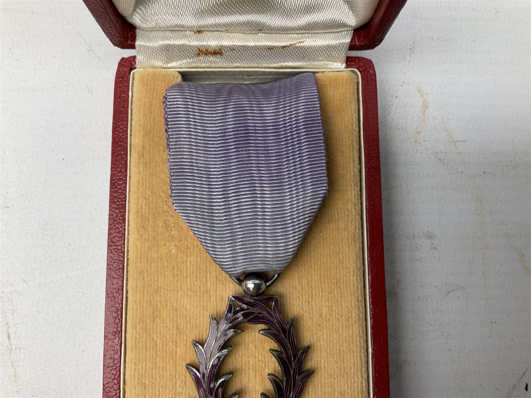 Five continental medals - WW1 Belgian Cross of Fire; WW1 French Croix De Guerre; French Croix De Combattant; French Republic Workers silver merit awarded to L. Mounet 1950; and boxed French Palmes Universitaires Officier d'Academie silver and enamel wreath (5)