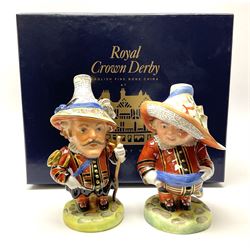 Pair of limited edition Royal Crown Derby Golden Jubilee Mansion House Dwarfs, Tall and Low Dwarf, dressed in Royal Guard uniform, H18cm, exclusive to Mulberry Hall 35/50, each with printed mark beneath, and signed M.E.Reynolds and J Morrison, with makers box. 