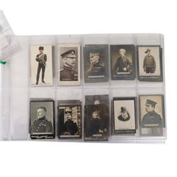 Collection of military cigarette cards, including Churchmans cigarette cards and Ogden's Guinea Cold Cigarettes