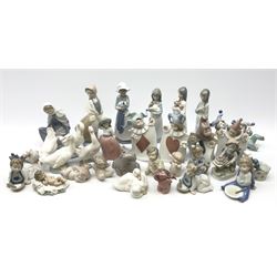 Collection of Nao figures, including four playing card jesters, two clowns, Virgin Mary and baby Jesus , five geese etc. 
