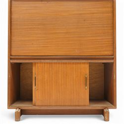 Robert Heritage (1927-2008) for Beaver & Tapley - Mid 20th century teak bureau, fall front with fitted interior, above a sliding door cabinet, raised on short supports