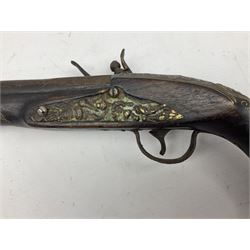Reproduction flintlock pistol, the full walnut stock with brass filigree inlay and mounts and skull crusher butt L46cm; no visible proof marks FIREARMS CERTIFICATE REQUIRED OR RFD