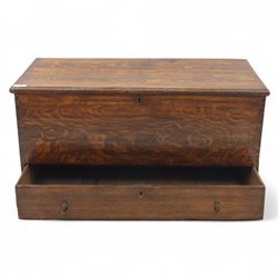 19th century oak blanket chest, rectangular hinged plank top with moulded edge, plain sides fitted with iron carrying handles, single full-width drawer to base with brass drop handles, on moulded plinth base