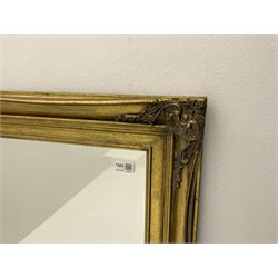 Classical bevel edge gilt mirror, floral detail and shaped moulding, 