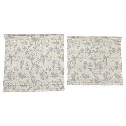 Two matching Roman blinds in Laura Ashley fabric - white ground and decorated in blue, trailing branches with flowers and birds, with wall mounts and mechanism (118cm x 123cm & 102cm x 116cm)