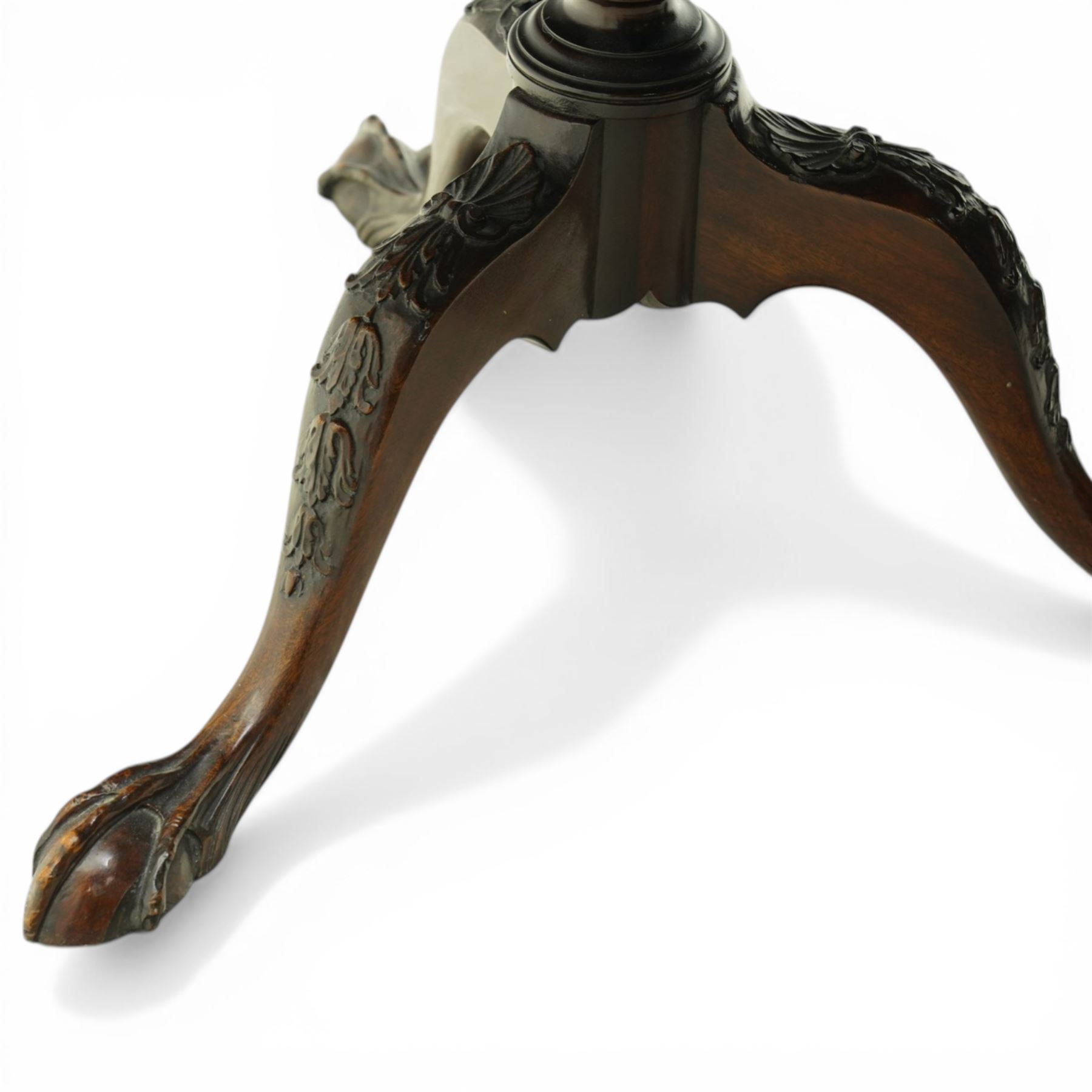 Late 19th century mahogany piecrust occasional table, circular top with scalloped moulded edge, on a turned pedestal with carved cabriole supports terminating in claw and ball feet