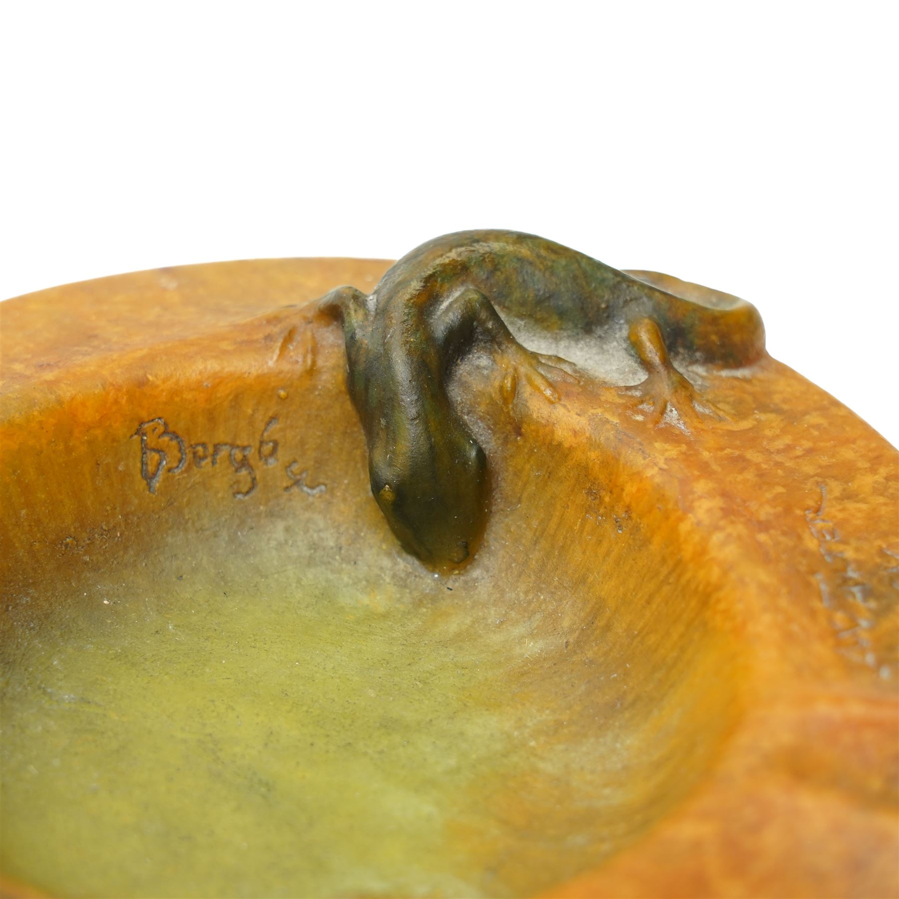 Amalric Walter (1870-1959) and Henri Berge (1868-1936), Nancy, France, circa 1920, pate de verre, Salamander ashtray, bearing moulded mark 'A Walter Nancy' and incised mark 'Berge sc.', D12cm

Note: Almaric Walter, born in Sèvres near Paris, exhibited at the Salon des Artistes Françaises in 1895 and 1903, and in 1908 moved to Nancy where he established his own workshop within the Daum glassworks. There he worked closely with Daum designers, including Henri Bergé. This ashtray is an example of Walter’s pâte-de-verre technique.

Provenance: From the collection of Andrew Chichester Everitt.