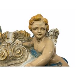 20th century Continental tin glazed holy water stoup, modelled with two cherubs, H27cm.  