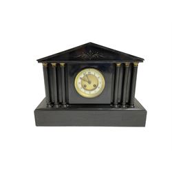 French - late 19th century 8-day mantle clock in a Belgium architectural slate case,  on a deep plinth with columns of recessed pillars flanking the dial, two part dial with a gilt centre and ivorine chapter with Roman numerals and fleur di Lis steel hands, twin train rack striking movement sounding the hours and half hours on a coiled gong. With pendulum.