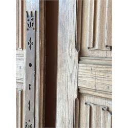 Decorative pair of French oak room screen doors, late 19th century, each having acanthus carved and turned spindles above four fielded linen fold panels. H258cm W72cm - COLLECTION BY APPOINTMENT FROM: The White House, Thirsk Road, Easingwold, York, YO61 3NF - CALL 01723 507111 TO ARRANGE