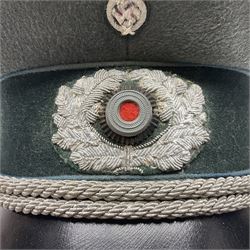 WW2 German Infantry Officer's visor cap with cloth insignia; labelled and stamped Offizier Kleiderkasse Berlin and Erel Stirnschutz