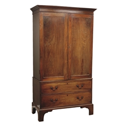  George III mahogany linen press, projecting cornice above two figured doors enclosing hanging space, two long drawers below, on tall bracket feet, W115cm, H208cm, D57cm  