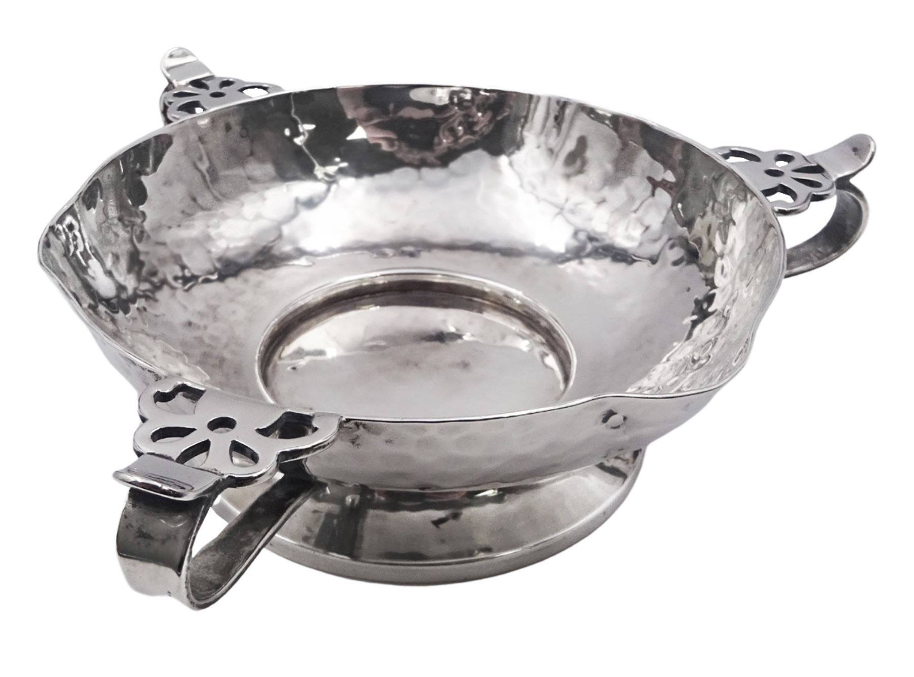 Arts & Crafts silver bowl, the planished bowl of circular form with three lips to rim, and three flower head capped curved handles, upon a circular spreading foot, hallmarked Charles Edwards, London 1904, 5.5cm D13cm, approximate weight 8.81 ozt (274 grams)