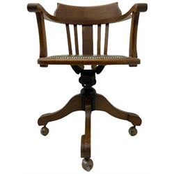 Early 20th century oak swivel desk chair, green leather seat with studded detail
