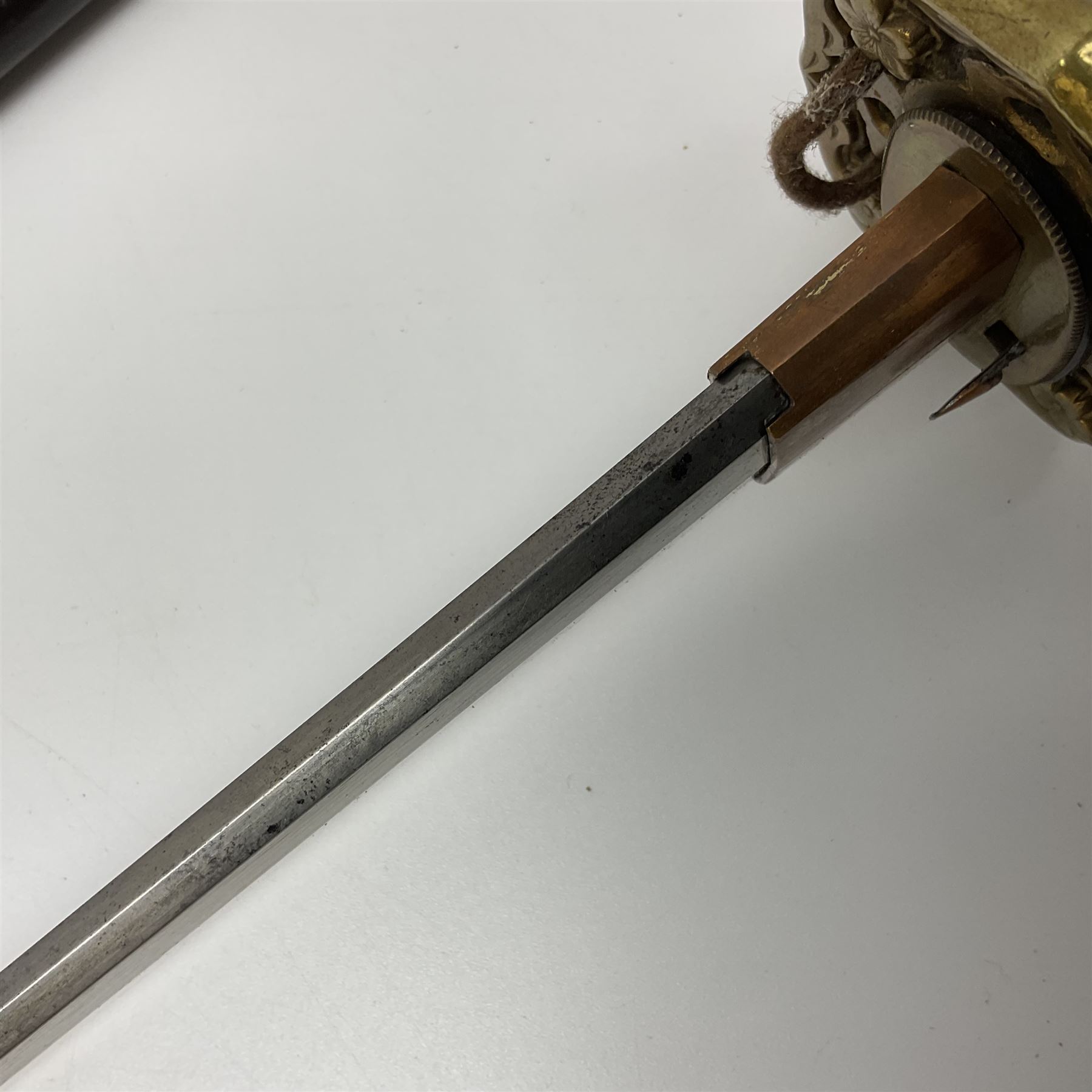 WW2 Japanese Army officer's shin gunto/katana sword with 68.5cm steel single edged blade, foliate cast brass tsuba, bound fish-skin grip with brass mounts, inscribed marks to both sides of tang; in lacquered wooden scabbard with brass mounts and locking button L97cm overall