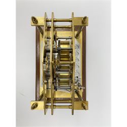 Mid 20th century 'Congreve' rolling ball clock, sloped arch and pierced brass movement, the central Arabic minute chapter ring flanked by hour and seconds dials, twin train driven eight day movement, raised on mahogany plinth with turned brass feet, under acrylic cover