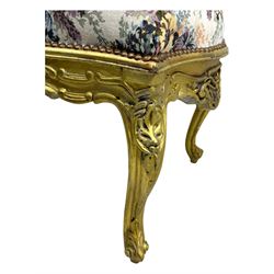 Pair of Louis XV-design giltwood stools, each upholstered in floral tapestry fabric, the carved frame adorned with scrolling foliage and shell motifs, raised on cabriole supports